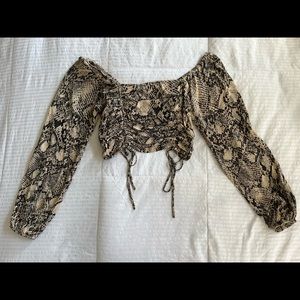 Snake print off the shoulder crop top with ties at bottom.